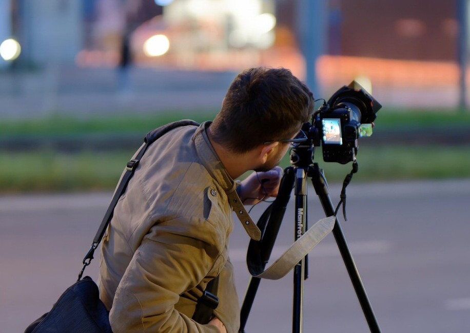 man photographing