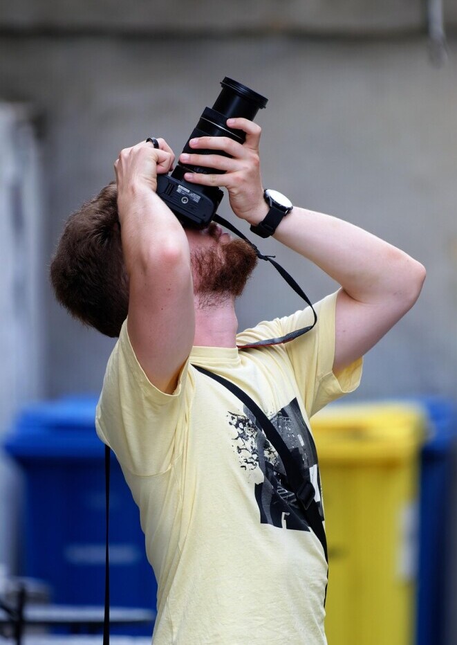 man photographing